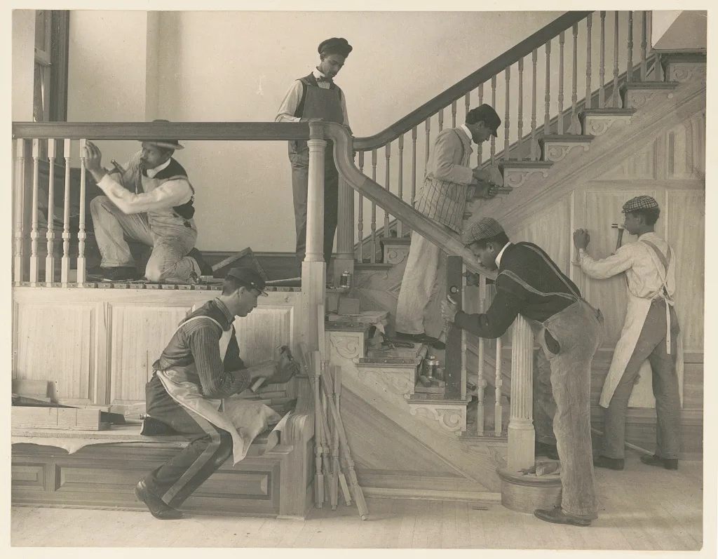 Students at work on a house built largely by them, Virginia, Hampton, 1899