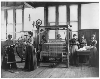 [African-American women weaving rug in home economics class at…, 1899