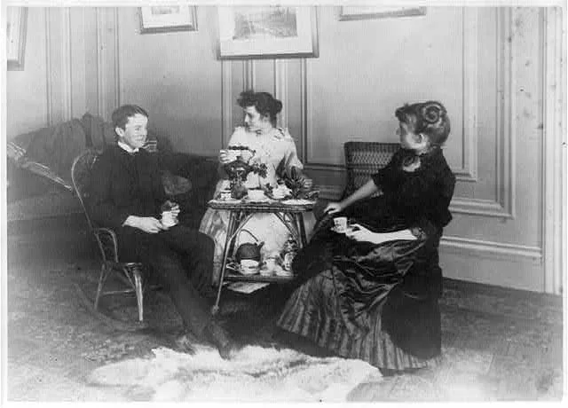 [Frances Benjamin Johnston, full lgth., seated, having tea with 2…