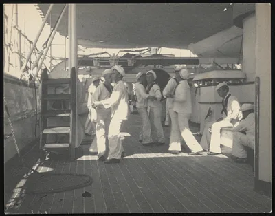 [Sailors dancing with each other aboard USS OLYMPIA], 1899