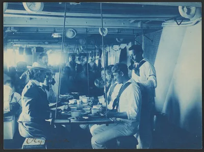 [Miss Johnston having a meal with the crew on the Olympia], 1899
