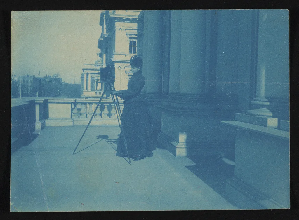 [Frances Benjamin Johnston with camera on balcony of State, War and…, Washington D.C., 1888